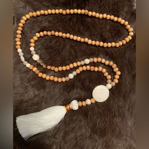 Beautiful wooden bead necklace with white tassel!